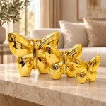 Trio de papillons décoratifs dorés