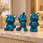 Trio d’ours décoratifs en céramique — Bleu canard et or
